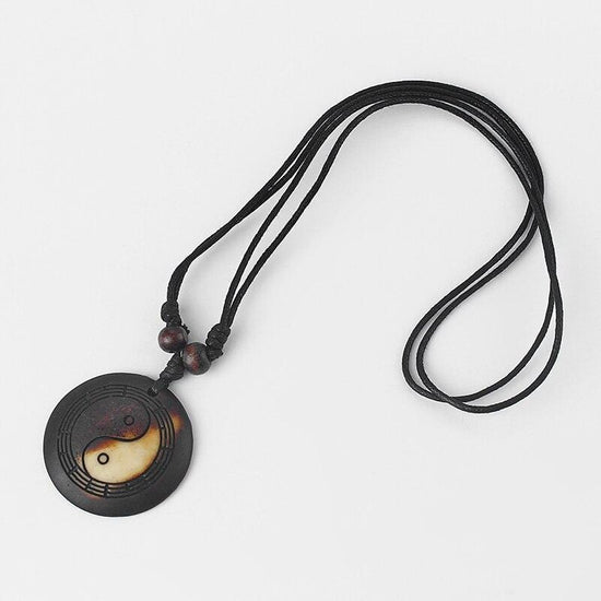black cord necklace with charm